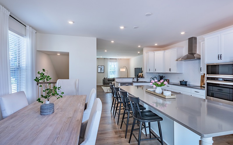 large kitchen with large islands and stainless steel appliances 